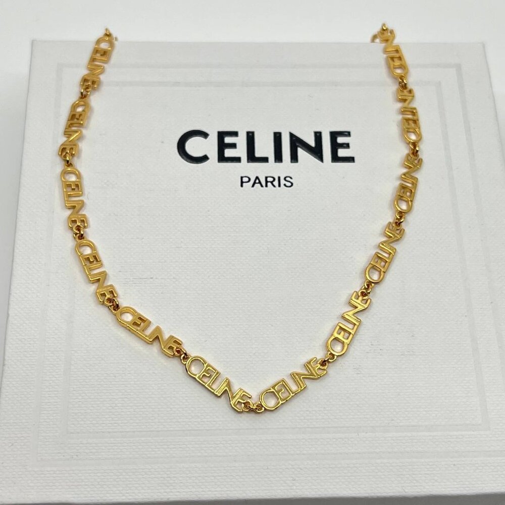 Authentic CELINE gold metal charm necklace with original box